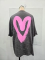 Detail of a large pink brushstroke heart print on a washed grey oversized cotton t-shirt - S / Washed Black