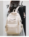 Rear view of a cream white high-density nylon backpack worn in a lifestyle setting - Basic Style / Milky White