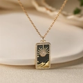 Golden tarot card pendant necklace with sun and star enamel motifs for beach vacations - Black Sun