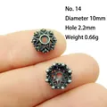 Macro shot of 10mm silver alloy flower bead spacer showing detailed hollow vintage craft - 14#