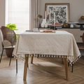 Beige floral cotton linen tablecloth with fringe edges on a wooden table in a sunny dining room - 60*60cm / White Daisy with Beige Tassels