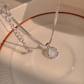 Elegant silver butterfly necklace with a moonstone-like round gemstone pendant - X913 Silver Copper Chain