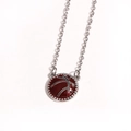 Detailed close-up of a red basketball pendant with silver metal chain on white background - Basketball / White Gold