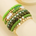 Detail of bohemian green and white polymer clay bead bracelets with gold accents - Green White Gold Combo