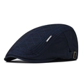 Detail of navy blue cotton ivy cap featuring diamond quilt stitching and metal side logo - Adjustable / Navy Blue