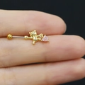 Detailed close-up of a golden teddy bear nipple ring featuring a pink heart-shaped zircon stone - Cartoon Bear Style (24082009056)