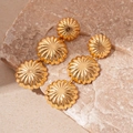 Macro shot of three-tier cascading golden dome earrings on natural beige stone - Gold 3-Tier Daisy Drop Earrings (Silver Earring Post)
