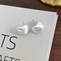 Macro detail of matte brushed metal teardrop earrings with a textured silver finish - Matte Silver