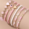 Set de bracelets en perles roses et blanches avec charms cœur doré et œil maléfique - Rose