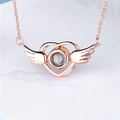Rose gold heart wings projection necklace featuring a micro-carved stone for women - Winged Heart Rose Gold