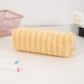 Close-up of fluffy yellow plush pencil case with zipper on a desk with stationery - Yellow