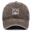Close-up of DOG MOM white embroidery and paw print on washed cotton baseball cap texture - Coffee