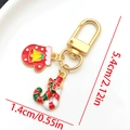 Christmas enamel keychain featuring red gloves and candy cane charms on a gold base - LS581-Christmas Candy Glove U-shaped Keychain