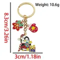 Christmas penguin keychain with gold keyring featuring red gloves and snowflake charms - ER1780-Gift Penguin Bow Snowflake Glove Keychain