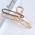 Detail of a gold metal paperclip hair claw clip with black and pink enamel coating - 11cm Safety Pin Hair Claw / Black