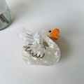Detail of white acetate swan hair claw clip with crystal accents and marble pattern - New Pearl White Swan