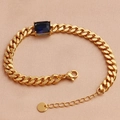 Detailed macro view of gold-plated chain bracelet with blue rectangular zircon and lobster clasp - 18K Gold / Royal Blue