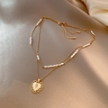 Double-layered gold titanium necklace featuring a heart pendant and white pearls - Titanium Steel Gold Style (X422)