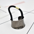 Gunmetal metallic ponytail cuff with black high-elastic hair tie on a white background - Crescent Moon / Black