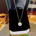 Elegante goldene Perlenkette mit Stern-Anhänger in einer grünen Samtschmuckschatulle - X558 Gold Stern Runde Scheibe