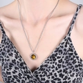 Silver snake chain necklace featuring round tiger eye stone pendant on leopard print model - Steel Color Tiger's Eye Necklace / 50cm