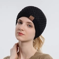 Women's black waffle knit beanie hat with brown leather sport patch detail - Black