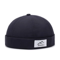 Black cotton docker hat with a minimalist mountain peak patch and roll brim design - Adjustable / Navy Blue