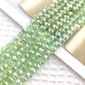 Macro shot of 8mm faceted light green AB crystal glass beads for DIY jewelry making - Fruit Green AB