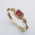 Macro detail of luxury square watch with red dial and gold diamond-encrusted floral strap - Rose Gold Case Red Dial