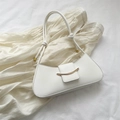 Minimalist white half-moon shoulder bag with gold metal buckle and knotted strap detail - White
