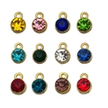 Set of twelve multi-colored birthstone charms in round gold-plated alloy frames - Mixed 12 Gold-Plated Birthstones