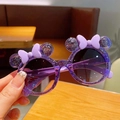 Detail of purple cartoon kids sunglasses with cute round ears and a 3D bow accent - Purple