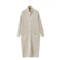 Women's long beige chunky knit cardigan with buttons and pockets in a clean studio view - S / Apricot