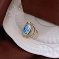 Adjustable gold enamel ring featuring a colorful oval abalone shell inlay on a ceramic tray - 16# Gold Oval Abalone Shell Iridescent Open Ring