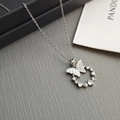 Detailed close-up of a silver butterfly pendant with mother of pearl and pearls - Iridescent Butterfly-Silver Purple 0366YZ
