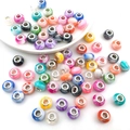 Detailed macro shot of colorful large hole beads with marble textures and metal centers - Mixed 10 Marble Pattern Beads