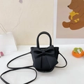 Mini black PU leather crossbody bag featuring a large bow and versatile shoulder strap - Black