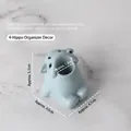 Cartoon hippo nail drill bit holder in light blue resin for desktop organization - Hippo