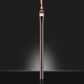 Detail of foundation liquid dripping on a synthetic concealer brush with rose gold handle - Concealer Brush