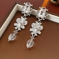 Macro view of vintage silver earrings with crystals and Baroque fringe details - Vintage Crystal Square Water Drop Dangle Earrings