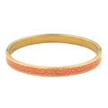 Detail of coral orange enamel flower pattern on a polished gold stainless steel bangle - Gold Orange