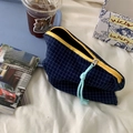 Detail of blue checkered cosmetic bag with yellow zipper on white linen background - Storage Pouch / Blue White Checkered
