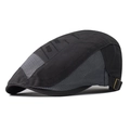 Detail view of breathable grey mesh and black fabric on a stylish flat cap with metal buckle - Adjustable / Gray