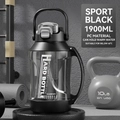 Detail of 1900ml sports water bottle with handle and flip lid in a gym setting - Black PC Version