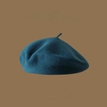 Detailed close-up of dark navy wool beret texture with vintage minimalist design - One Size / Teal