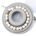 Elegant white pearl bracelet with gold spacers on a 15cm grey display tray - Flocked Plastic / Grey Sizing Tray (15cm)