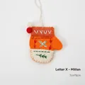 Orange felt Christmas glove ornament with green leaf embroidery and mini pom-poms - Letter X Orange Glove