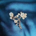 Golden camellia flower brooch with white shell petals and pearls on blue silk - Plum Blossom Brooch