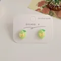 Cute green lemon earrings with 925 silver needles and yellow bowknot details - Green Mango Lemon