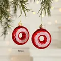 Red donut Christmas ornament with pink glitter patterns hanging on a green pine tree branch - Donut (Set of 2)